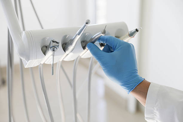 Professional Tooth Extraction technician working in Devens, MA